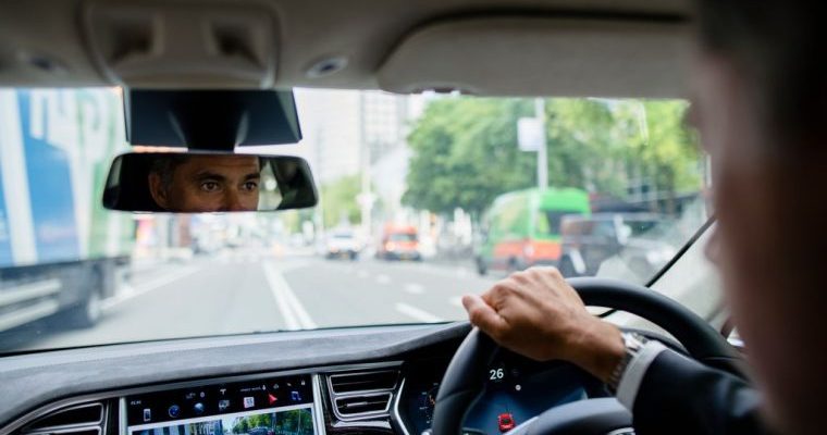 man driving tesla