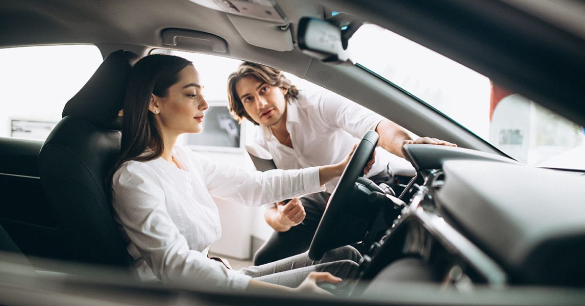 woman-choosing-car-car-showroom