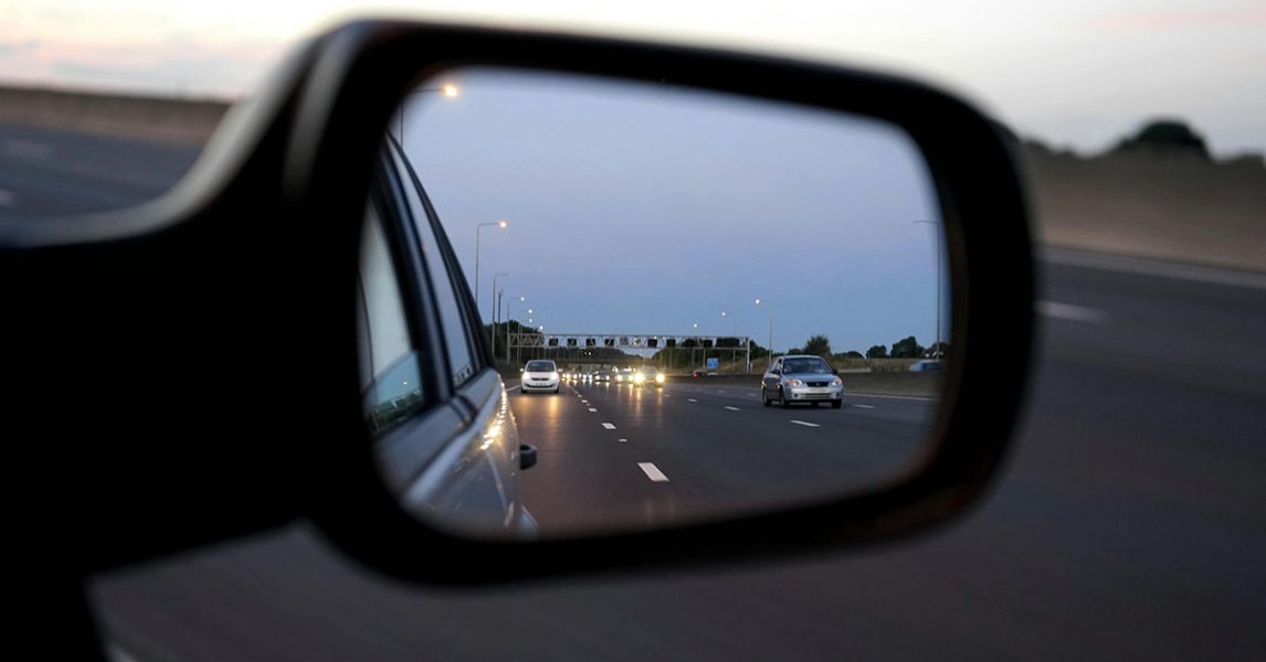 Checking the side mirror while driving